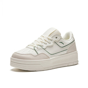 White sneaker with a brand logo on a white background