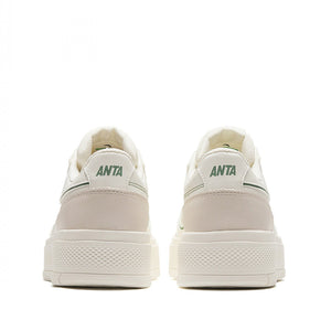 Pair of beige sneakers with 'ANTA' branding on a white background