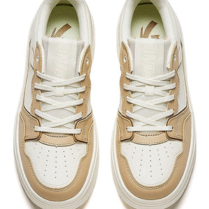 Pair of beige and white sneakers on a white background